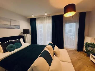 Łóżko lub łóżka w pokoju w obiekcie Wileńska home apartment 3
