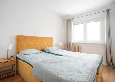 Łóżko lub łóżka w pokoju w obiekcie First Green Żoliborz apartament 7