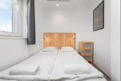 Łóżko lub łóżka w pokoju w obiekcie Racławicka 42 by Homeprime