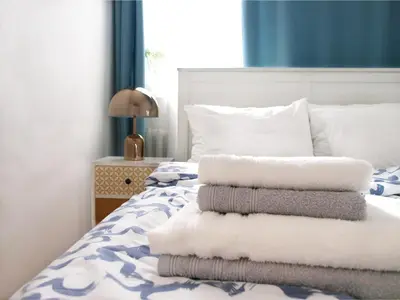 Łóżko lub łóżka w pokoju w obiekcie Apartament Rondo ONZ
