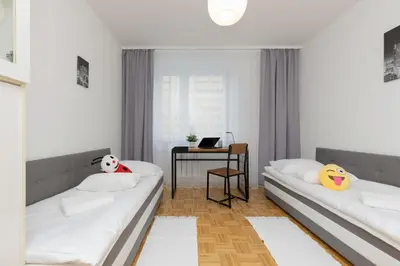 Łóżko lub łóżka w pokoju w obiekcie Family Apartment Bogatyńska Bemowo by Noclegi Renters