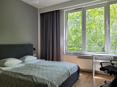 Łóżko lub łóżka w pokoju w obiekcie Chopin Apartments Expo