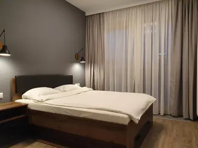 Łóżko lub łóżka w pokoju w obiekcie Chopin Apartments Expo