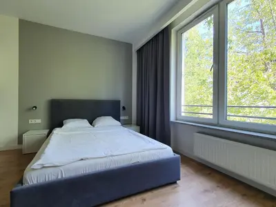 Łóżko lub łóżka w pokoju w obiekcie Chopin Apartments Expo