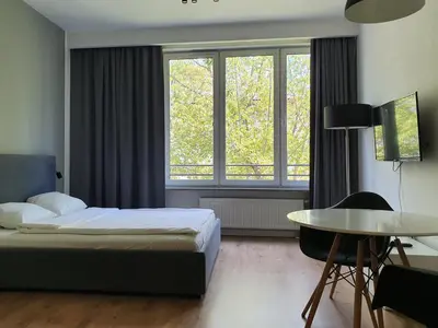 Łóżko lub łóżka w pokoju w obiekcie Chopin Apartments Expo