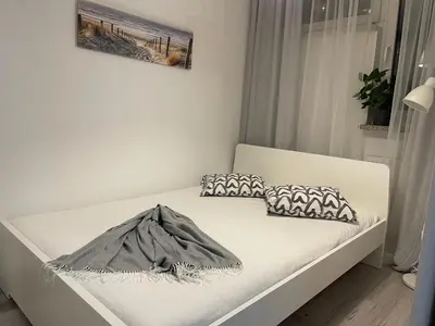 Łóżko lub łóżka w pokoju w obiekcie Marszalkowska 111 Apartment Centrum Warszawa