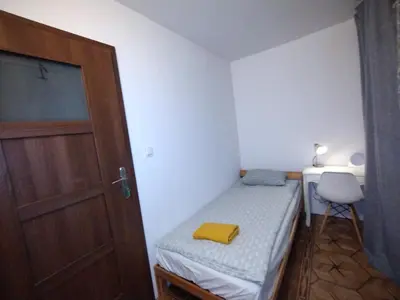 Łóżko lub łóżka w pokoju w obiekcie Ivory House (Marymont-Ruda)