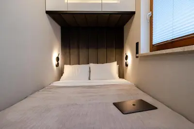Łóżko lub łóżka w pokoju w obiekcie Apartment Wola, WI-FI, Smart Lock, Air Condition