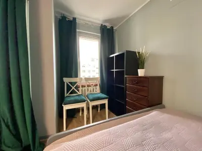 Łóżko lub łóżka w pokoju w obiekcie K22 Al Jana Pawła II Apartments 1