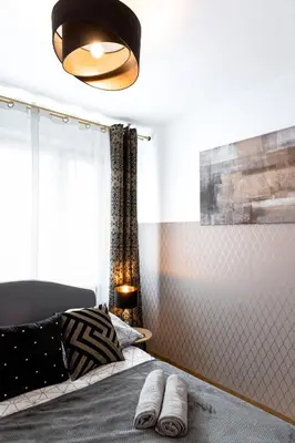 Łóżko lub łóżka w pokoju w obiekcie ClickTheFlat Conrada Apart Rooms