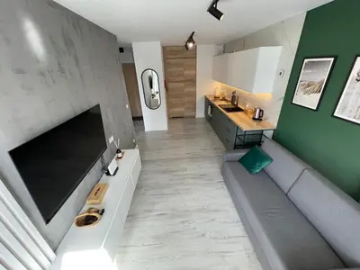 Telewizja i/lub zestaw kina domowego w obiekcie Vienne Appartment 90
