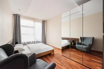 Łóżko lub łóżka w pokoju w obiekcie Wilanów Luxury Green Apartment by BookingHost