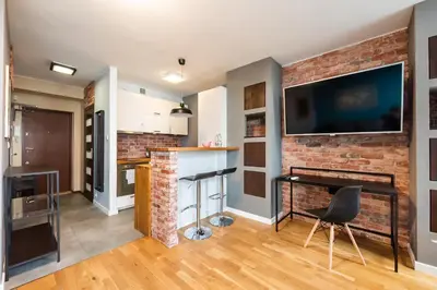 Kuchnia lub aneks kuchenny w obiekcie Ratusz Arsenał Modern City Apartment by BookingHost