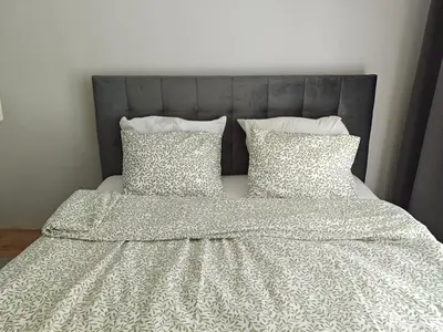 Łóżko lub łóżka w pokoju w obiekcie Apartment Talarowa Delux