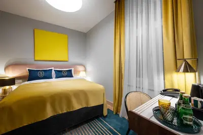 Łóżko lub łóżka w pokoju w obiekcie Sava Boutique Hotel
