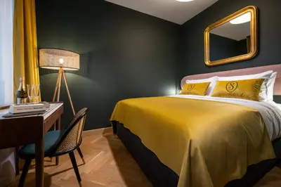 Łóżko lub łóżka w pokoju w obiekcie Sava Boutique Hotel