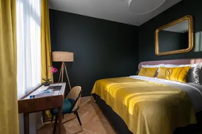 Łóżko lub łóżka w pokoju w obiekcie Sava Boutique Hotel