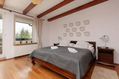 Łóżko lub łóżka w pokoju w obiekcie Quiet Bemowo House with Garden by Noclegi Renters