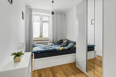 Łóżko lub łóżka w pokoju w obiekcie OldTown Cosy Apartment