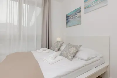 Łóżko lub łóżka w pokoju w obiekcie Oś Królewska - Comfortable Apartment in Wilanów
