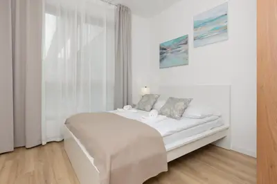 Łóżko lub łóżka w pokoju w obiekcie Oś Królewska - Comfortable Apartment in Wilanów