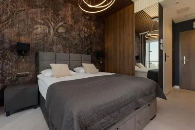 Łóżko lub łóżka w pokoju w obiekcie Exceptional Business Apartments by Noclegi Renters