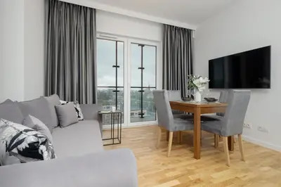 Telewizja i/lub zestaw kina domowego w obiekcie Exceptional Business Apartments by Noclegi Renters