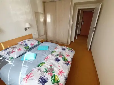 Łóżko lub łóżka w pokoju w obiekcie 10Q - Z6 Apartament 1001