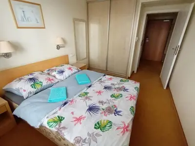 Łóżko lub łóżka w pokoju w obiekcie 10Q - Z6 Apartament 1002