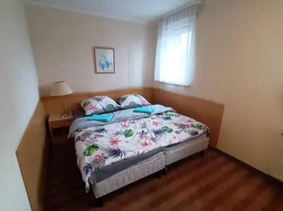Łóżko lub łóżka w pokoju w obiekcie 10Q - Z6 Apartament 1004