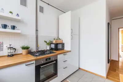 Kuchnia lub aneks kuchenny w obiekcie SuperApart Nowolipki 23, Unwind in Urban Chic Apartament