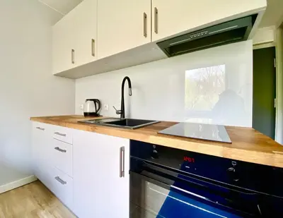 Kuchnia lub aneks kuchenny w obiekcie K22 Park Mokotow Aparts