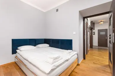 Łóżko lub łóżka w pokoju w obiekcie Apartament Mariensztat by Your Freedom