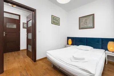 Łóżko lub łóżka w pokoju w obiekcie Apartament Mariensztat by Your Freedom