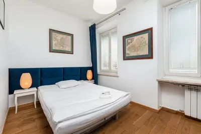 Łóżko lub łóżka w pokoju w obiekcie Apartament Mariensztat by Your Freedom