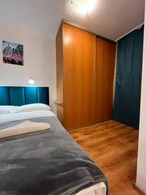 Łóżko lub łóżka w pokoju w obiekcie Murano Apartaments Atrium