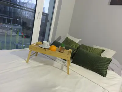 Łóżko lub łóżka w pokoju w obiekcie Nowoczesny apartament z garażem i balkonem Mokotów