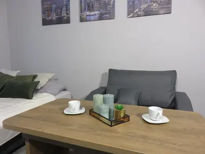 Łóżko lub łóżka w pokoju w obiekcie Nowoczesny apartament z garażem i balkonem Mokotów
