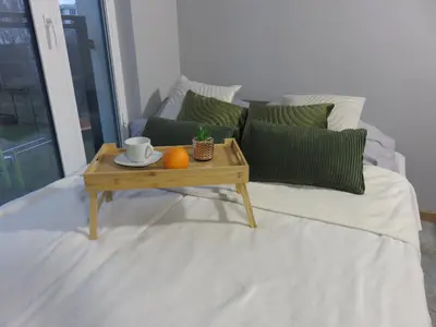 Łóżko lub łóżka w pokoju w obiekcie Nowoczesny apartament z garażem i balkonem Mokotów