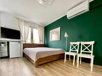 Łóżko lub łóżka w pokoju w obiekcie K22 Al Jana Pawła II Apartments 2