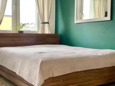 Łóżko lub łóżka w pokoju w obiekcie K22 Al Jana Pawła II Apartments 2