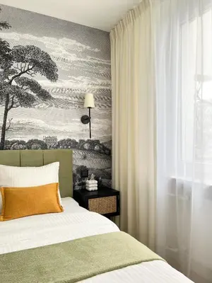 Łóżko lub łóżka w pokoju w obiekcie Gustowny apartament przy metrze
