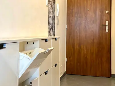 Łóżko lub łóżka w pokoju w obiekcie K22 Postępu 10 Aparts Warsaw