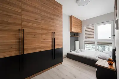 Łóżko lub łóżka w pokoju w obiekcie New Varsovia Comfort 1604 by BookingHost