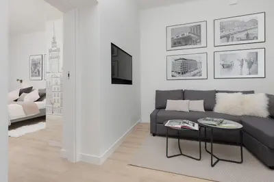 Telewizja i/lub zestaw kina domowego w obiekcie Spacious Apartment with Panoramic View of Warsaw by Noclegi Renters