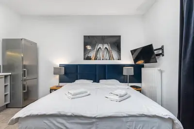Łóżko lub łóżka w pokoju w obiekcie Apartamenty Piękna 28A by Your Freedom