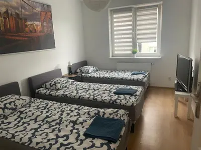 Łóżko lub łóżka w pokoju w obiekcie Pokoje KEN