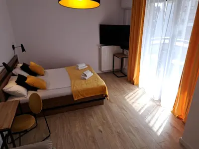 Łóżko lub łóżka w pokoju w obiekcie Kłopot Warszawa