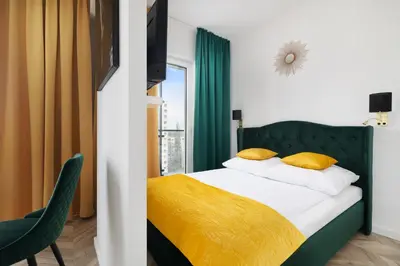 Łóżko lub łóżka w pokoju w obiekcie Vola Palace