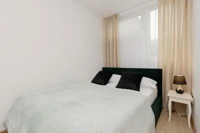 Łóżko lub łóżka w pokoju w obiekcie Warsaw City Centre & Pet-friendly Studio by Noclegi Renters